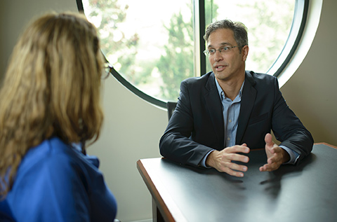 Photo of Erik doing mediation with client